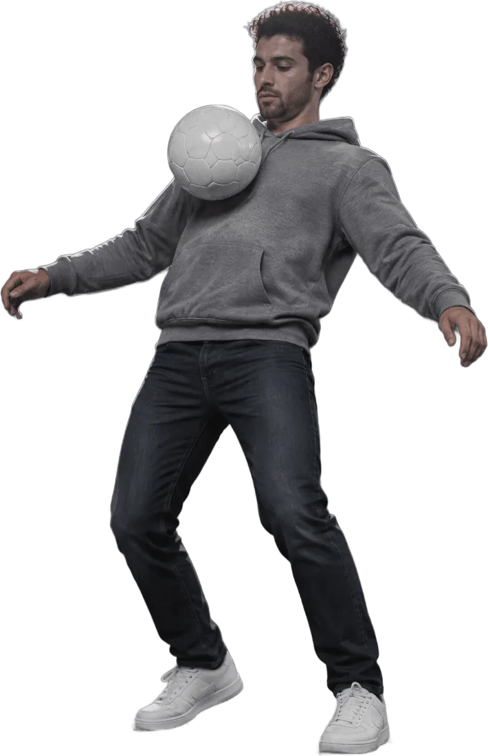 A made-up player in a grey hoodie controls the ball on his chest